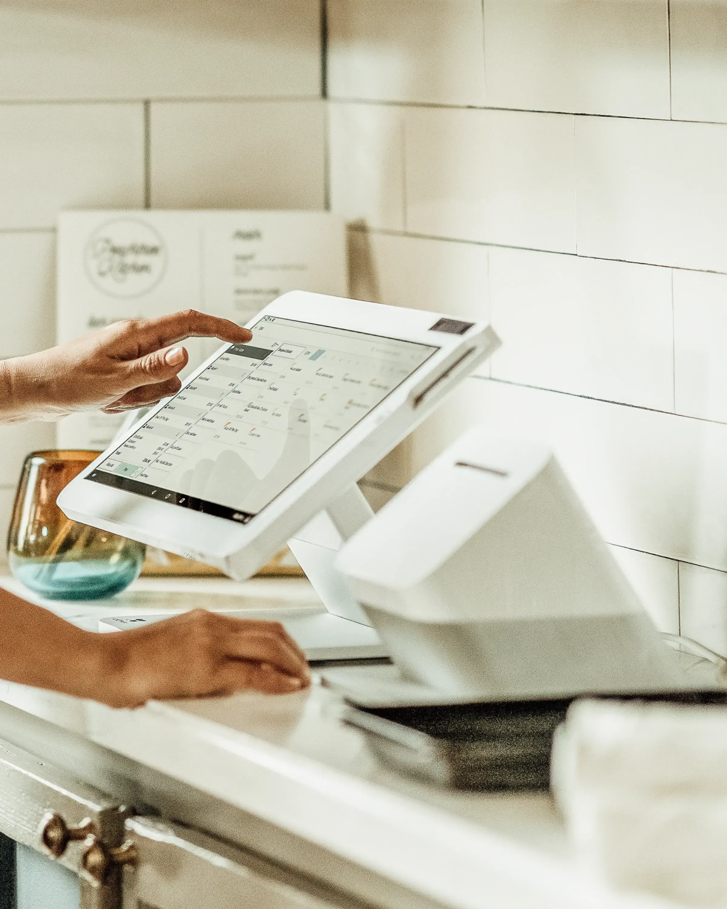 A checkout lane with a Clover Station mounted at the counter.